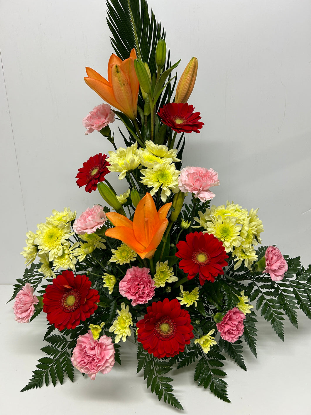 Centro alto lilium, gerberas y clavel